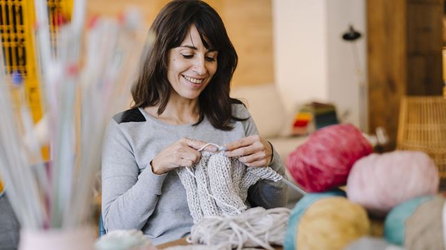 Crafting for mental health; woman knitting